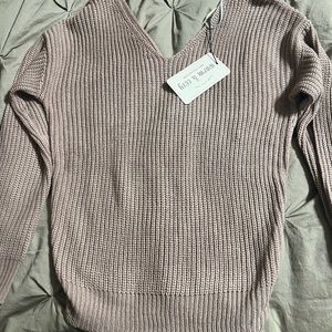 Brand new sweater with tie on back